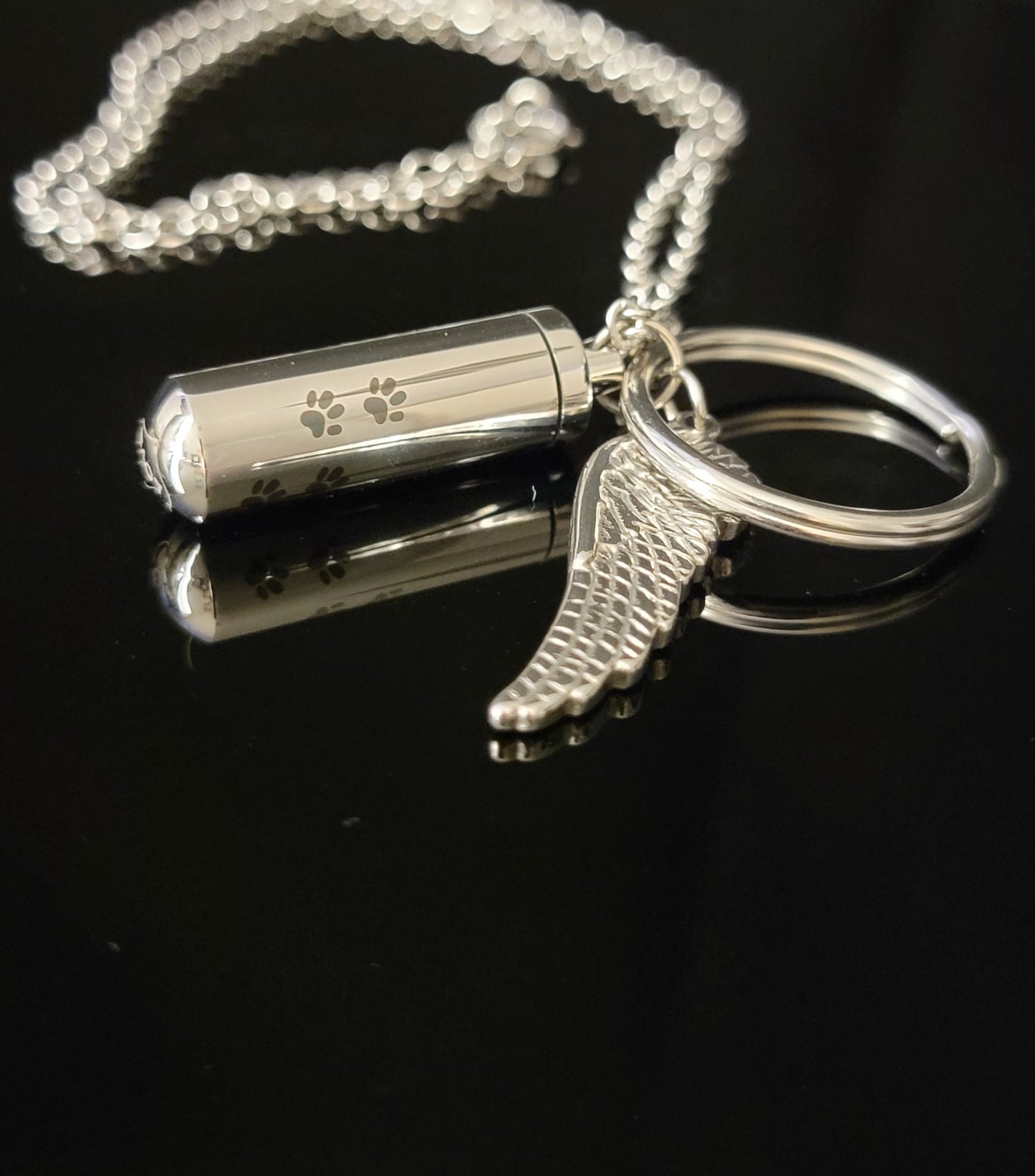 Medium size Cylinder style Cremation Urn Necklace for ashes with Angel Wing charm with Paw Prints