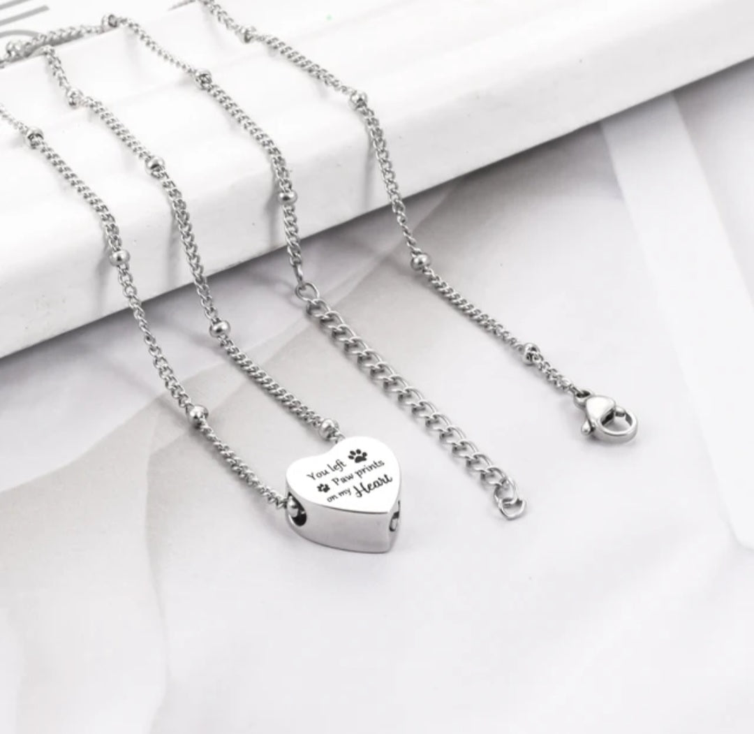 Heart shaped Cremation Urn Necklace for ashes "You left paw prints on my heart"